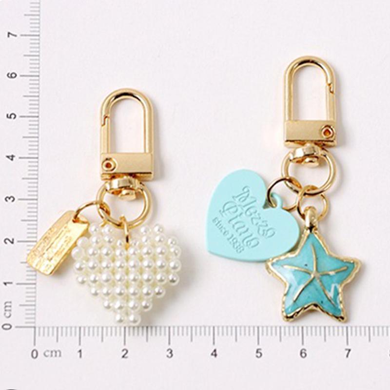 Keychains S Ins Five-pointed Star Shell Pendant Bluetooth Headset Case Key Chain Bag 2022, Silver
Keychains S Ins Five-pointed Star Shell Pendant Bluetooth Headset Case Key Chain Bag 2022, Silver
