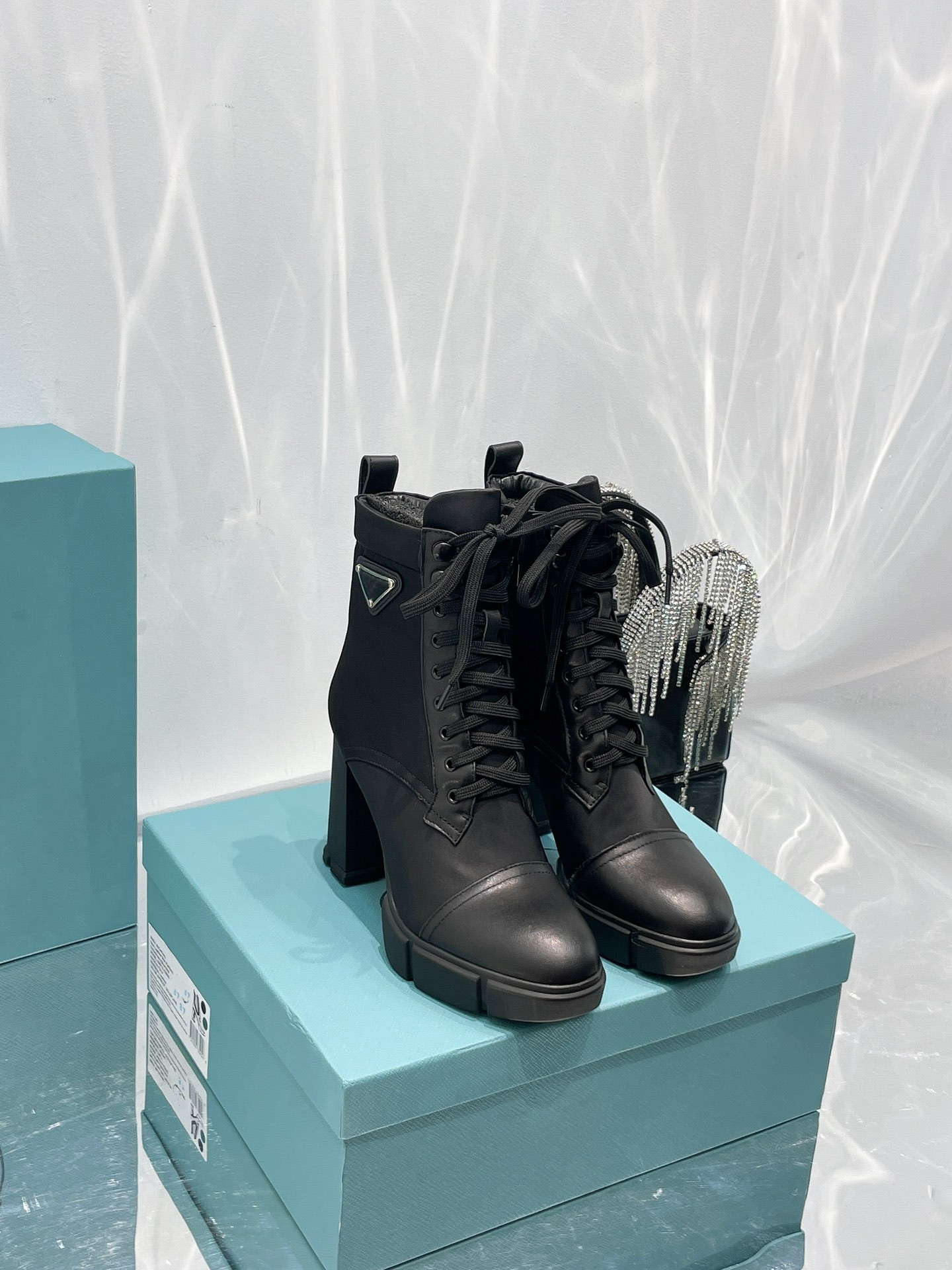 Fashion Boots Brushed leather and nylon laced booties Upper with metal eyelets hooks Leathers lining 55 mm monobloc rubber sole Lug tread Size 35-41, Black
Fashion Boots Brushed leather and nylon laced booties Upper with metal eyelets hooks Leathers lining 55 mm monobloc rubber sole Lug tread Size 35-41, Black
