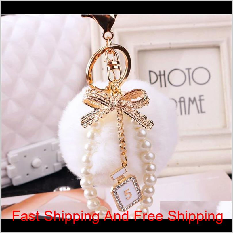 2020 Fashion Pearl Chain Crystal Bottle Bow Pompom Keychain Car Women Handbag Key Chain Ring Fluffy Puff Ball Keychains Jewelry Ctgoj Nm063, Silver
2020 Fashion Pearl Chain Crystal Bottle Bow Pompom Keychain Car Women Handbag Key Chain Ring Fluffy Puff Ball Keychains Jewelry Ctgoj Nm063, Silver