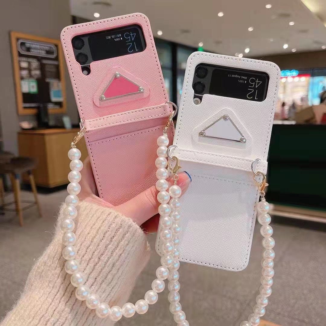 For Samsung Galaxy Z Flip 2 Leather Cover Case Luxury Pearl Chain Wristband Women Fashion Designer Brand Phone Cases For Samsung Galaxy Z Flip 1 3 ZFlip3 5G, White
For Samsung Galaxy Z Flip 2 Leather Cover Case Luxury Pearl Chain Wristband Women Fashion Designer Brand Phone Cases For Samsung Galaxy Z Flip 1 3 ZFlip3 5G, White