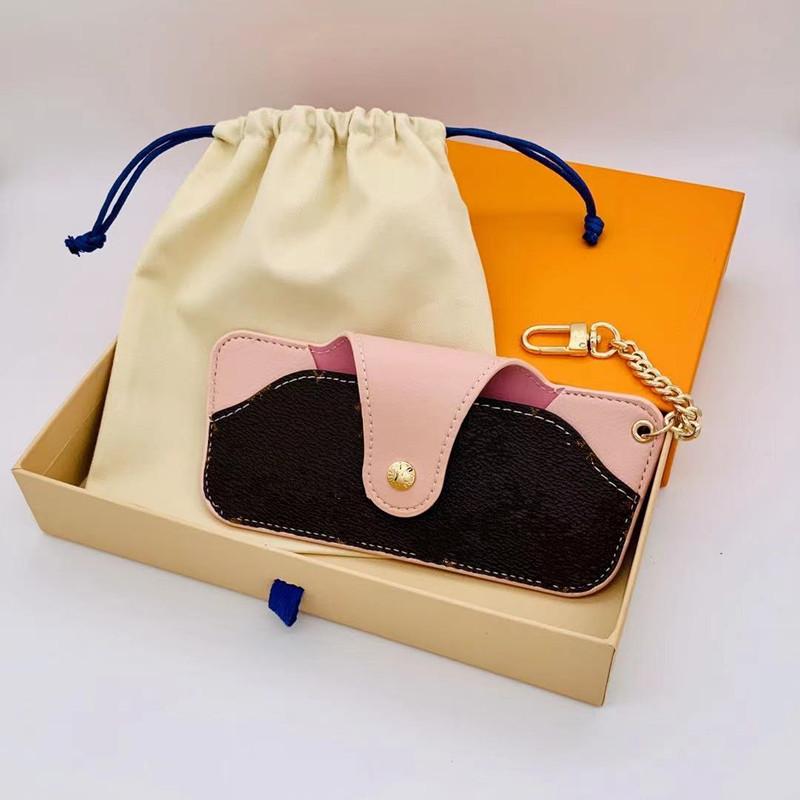 Fashion Designer Leather Glass bag Keychain Key ring sunglasses Cases Pendant Car Chain Pandents Charm Brown Flower Keychains Gifts Accessories WITH BOX
Fashion Designer Leather Glass bag Keychain Key ring sunglasses Cases Pendant Car Chain Pandents Charm Brown Flower Keychains Gifts Accessories WITH BOX