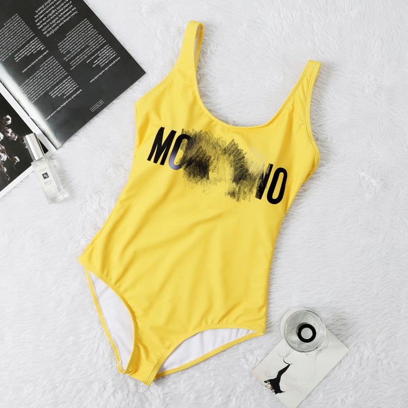 2121 new fashion brand swimsuit women's feeling open back triangle one piece letter solid color holiday swimsuit, White;black
2121 new fashion brand swimsuit women's feeling open back triangle one piece letter solid color holiday swimsuit, White;black