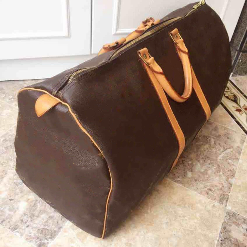 Designers Duffel Bags 45CM 55CM luxury large capacity travel sale High quality women men Genuine Leather shoulder Fashion bag carry rivets with lock head 56, Dustbag
Designers Duffel Bags 45CM 55CM luxury large capacity travel sale High quality women men Genuine Leather shoulder Fashion bag carry rivets with lock head 56, Dustbag