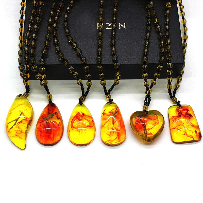 Imitation amber stone inclusive amber Baltic pendant necklace home decoration stone wedding reception gift
Imitation amber stone inclusive amber Baltic pendant necklace home decoration stone wedding reception gift
