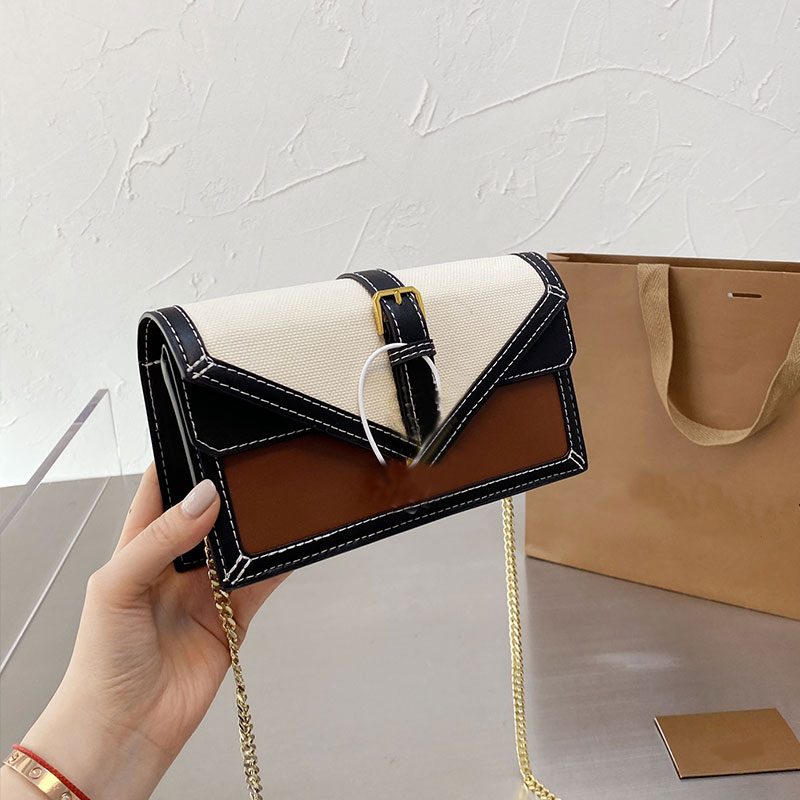 Envelope Purse Chain Package Women Shoulder Bags Fashion Canvas Patchwork Color Matching Hasp Gold Hardware Parts Thread High Quality
Envelope Purse Chain Package Women Shoulder Bags Fashion Canvas Patchwork Color Matching Hasp Gold Hardware Parts Thread High Quality