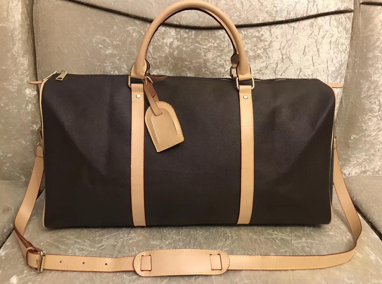 55CM PU large capacity women travel bags 2021 sale quality men shoulder duffel bags carry on luggage bottom rivets with lock head
55CM PU large capacity women travel bags 2021 sale quality men shoulder duffel bags carry on luggage bottom rivets with lock head