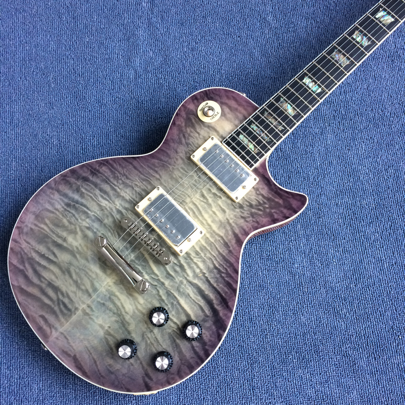 Mahogany one piece body and a neck guitar,Tune-o-Matic bridge ,ebony Fingerboard Real Abalone inlay frets binding, Quilte Maple top170919
Mahogany one piece body and a neck guitar,Tune-o-Matic bridge ,ebony Fingerboard Real Abalone inlay frets binding, Quilte Maple top170919