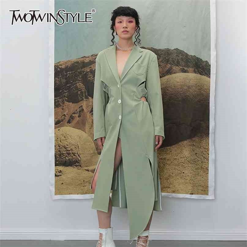 TWOTWINSTYLE Irregular Split Windbreaker For Female Lapel Collar Long Sleeve High Waist Hollow Out Drawstring Trench Coats Women 210820