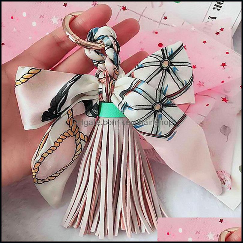 Keychains Fashion Accessories High Quality Scarves Key Holder Ribbon Bowknot Exquisite Pu Leather Tassels Women Bag Charm Pendant1 Drop Deli
Keychains Fashion Accessories High Quality Scarves Key Holder Ribbon Bowknot Exquisite Pu Leather Tassels Women Bag Charm Pendant1 Drop Deli