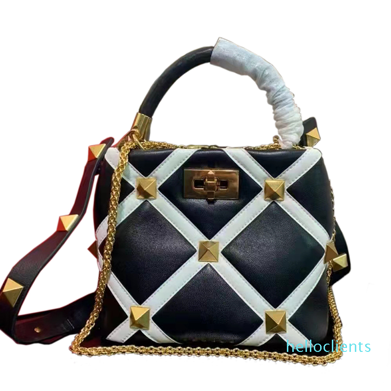 Genuine Leather Handbag Large stud bag Black and white color matching shoulder strap Two-tone luxurys Fashion Designers Bags Brass, Box
Genuine Leather Handbag Large stud bag Black and white color matching shoulder strap Two-tone luxurys Fashion Designers Bags Brass, Box