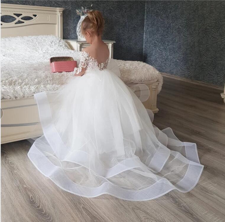 Cute Floer Girls Dresses White Lace Appliques Tulle Jeel Neck Long Sleeves Seep Train Birthday Communion Children Girl Pageant Gons Open Back Tiered