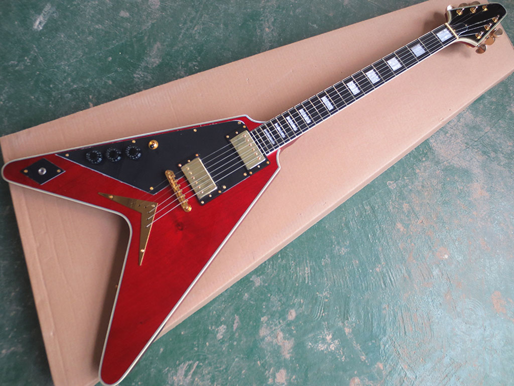 Flying V left - handed electric guitar with wine - red body
Flying V left - handed electric guitar with wine - red body