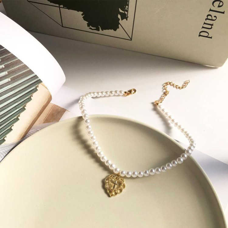 L29 cute and sweet pearl clavicle chain hollow cross love pendant fashion Necklace women
L29 cute and sweet pearl clavicle chain hollow cross love pendant fashion Necklace women