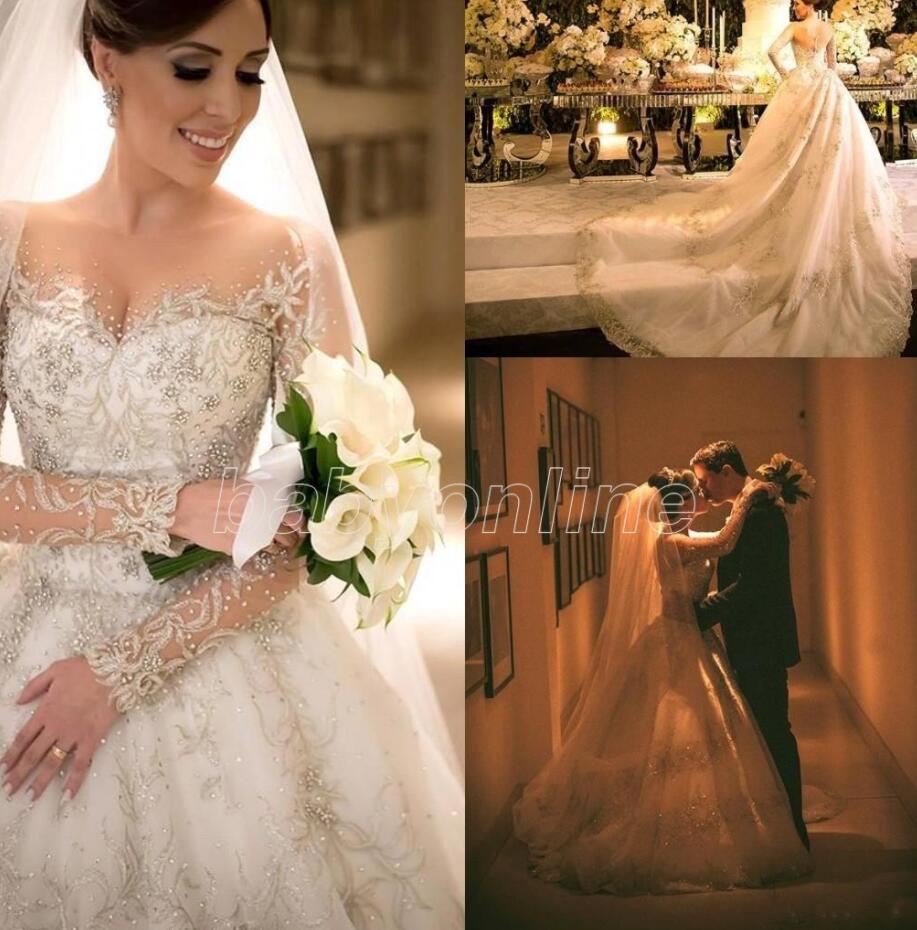 New Arabic Wedding Dresses Sheer Luxury Lace Beaded Applique handmade 3D floral Long Sleeve Cathedral Plus Size Wedding Gowns VOG343, White
New Arabic Wedding Dresses Sheer Luxury Lace Beaded Applique handmade 3D floral Long Sleeve Cathedral Plus Size Wedding Gowns VOG343, White