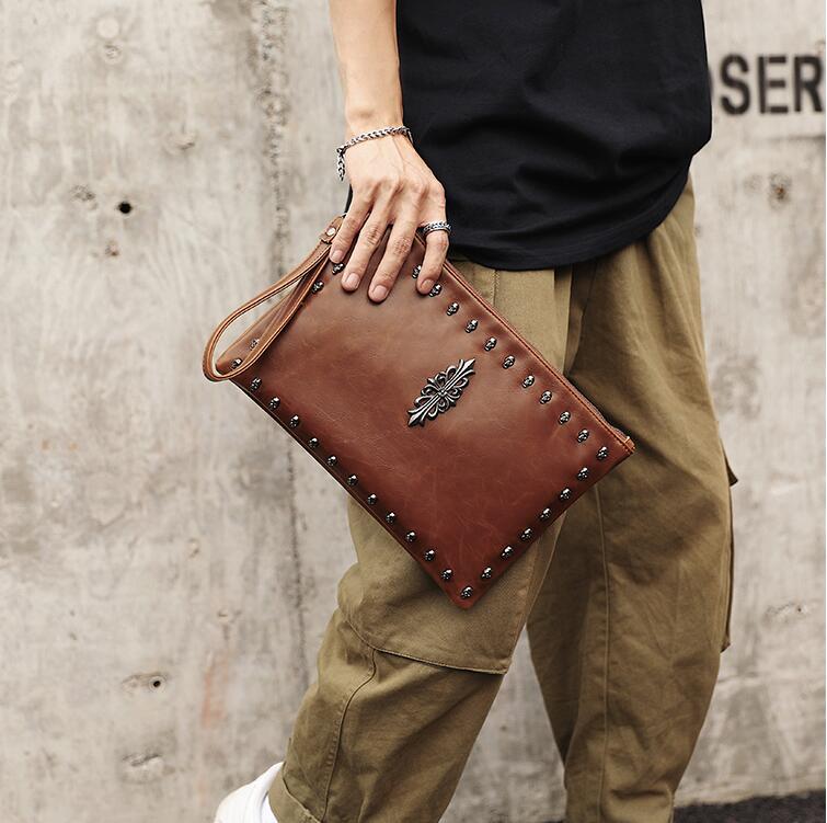 Factory wholesale men handbag street trend rivet punk hand bag ghost head pattern menes wrist handbags retro leather mens messenger bags