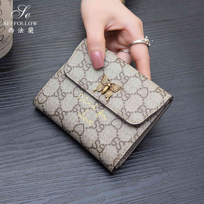 wallet 2021 women's short multi-functional three fold buckle simple versatile foldable fashion, Red;black
wallet 2021 women's short multi-functional three fold buckle simple versatile foldable fashion, Red;black