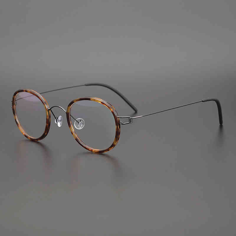 Denmark Brand Designer Hand Made Titanium Glasses Frame Men Women Ultralight Vintage Round Optical Eyeglasses with Acetate Ring 210323
Denmark Brand Designer Hand Made Titanium Glasses Frame Men Women Ultralight Vintage Round Optical Eyeglasses with Acetate Ring 210323
