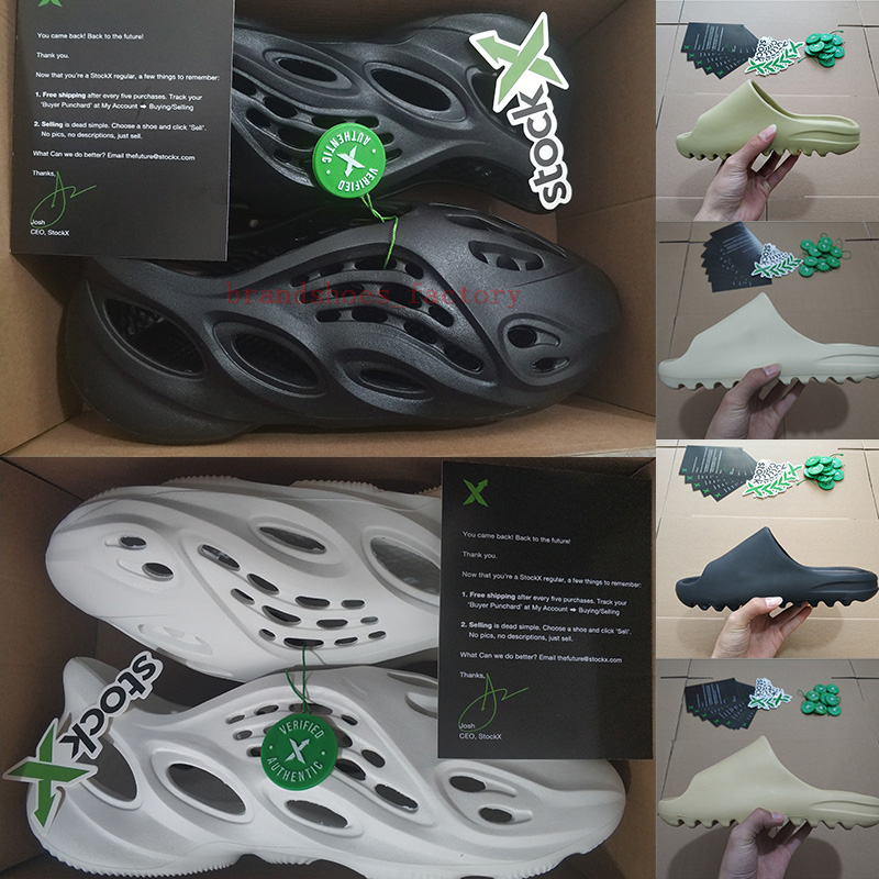 Yessy Slides Mens Slippers Foam Runner Kanye West Womens Designer Sandals Resin Pure Moon Grey Triple Black White Sand Bone Sliders With Box
Yessy Slides Mens Slippers Foam Runner Kanye West Womens Designer Sandals Resin Pure Moon Grey Triple Black White Sand Bone Sliders With Box