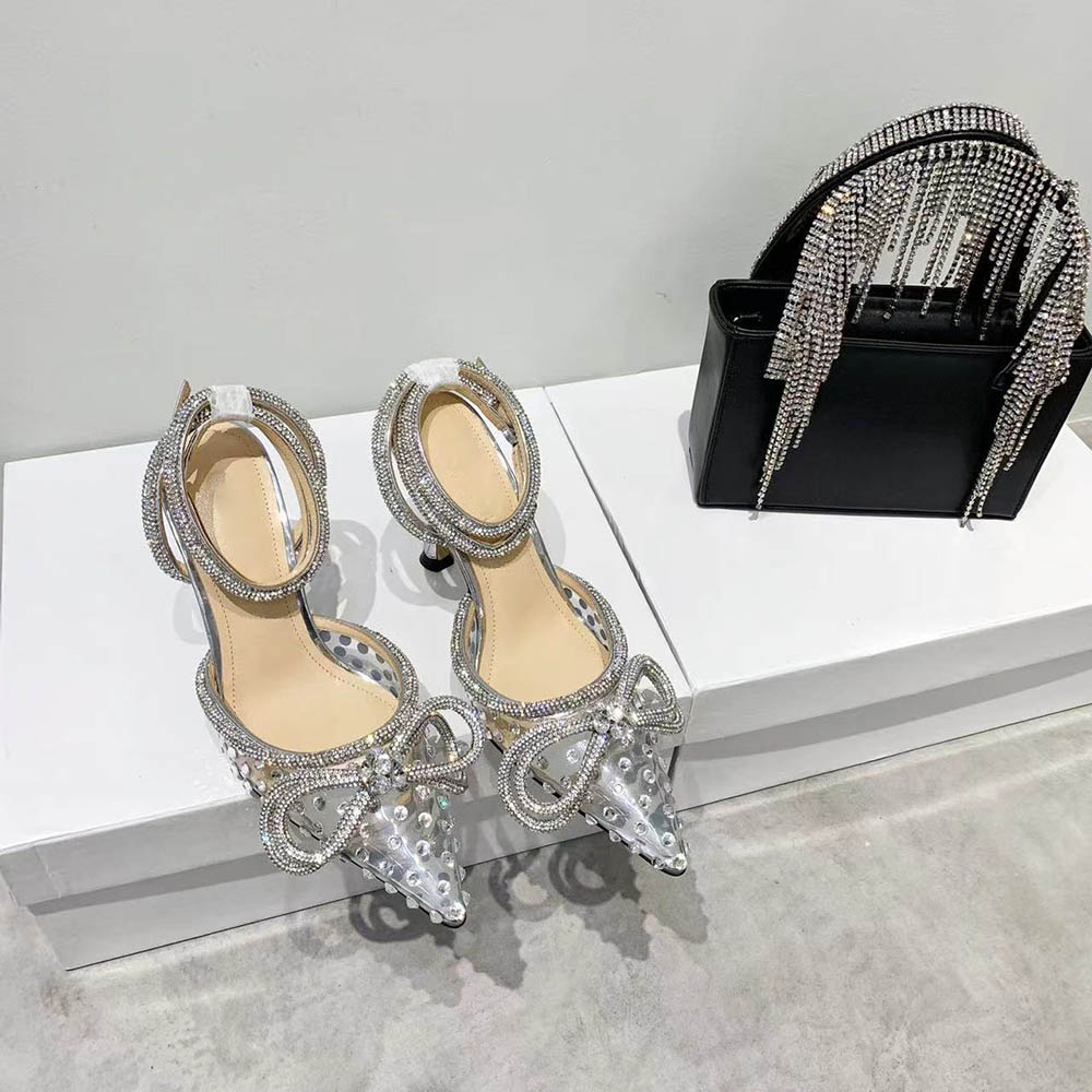 2021 Women Dress Shoes Bling MACH Transparent PVC Film Sandals Heels Weddings Pumps Pointed Toe Slip On 9.5cm High Heel Wedding Bow Diamond Shoe
2021 Women Dress Shoes Bling MACH Transparent PVC Film Sandals Heels Weddings Pumps Pointed Toe Slip On 9.5cm High Heel Wedding Bow Diamond Shoe