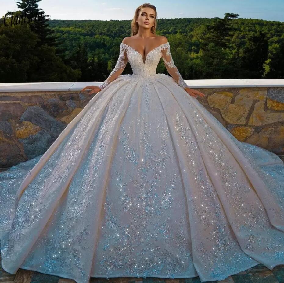 Sparkly Sequined Appliques Long Sleeve Dubai Saudi Arabic Ball Gown Wedding Dress Off The Shoulder Open Back Bridal Gown, White
Sparkly Sequined Appliques Long Sleeve Dubai Saudi Arabic Ball Gown Wedding Dress Off The Shoulder Open Back Bridal Gown, White