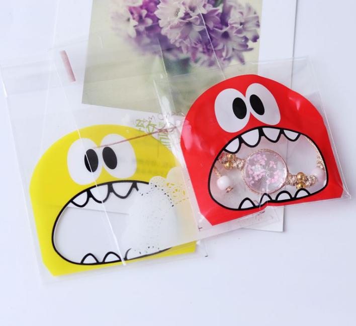 2021 Cute Big Teech Mouth Monster Plastic Bag Wedding Birthday Cookie Candy Gift Packaging Bags OPP Self Adhesive Party Favors
2021 Cute Big Teech Mouth Monster Plastic Bag Wedding Birthday Cookie Candy Gift Packaging Bags OPP Self Adhesive Party Favors