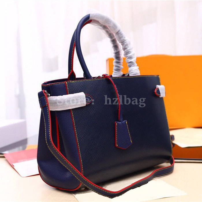 Twist Tote Indigo Blue/Coquelicot Red Twist-Lock For Day-To-Business Versatile Shoulder Bags Grained Cowhide Leather, Color 02
Twist Tote Indigo Blue/Coquelicot Red Twist-Lock For Day-To-Business Versatile Shoulder Bags Grained Cowhide Leather, Color 02