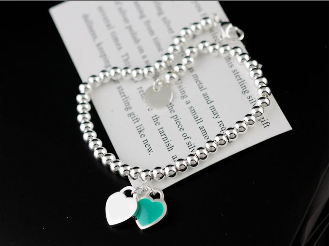 2021 big silver gold balls beads stainless steel high quality Charm Bracelets with double green heart and round plate free box & dastbag
2021 big silver gold balls beads stainless steel high quality Charm Bracelets with double green heart and round plate free box & dastbag