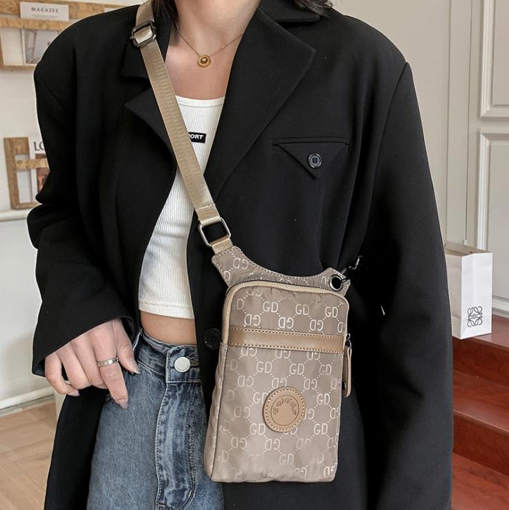 Shoulder Bags 2022 Brand Design Personality Mobile Phone Female Crossbody Hanging Neck Cloth Small Change Summer Mini Bag, Black1
Shoulder Bags 2022 Brand Design Personality Mobile Phone Female Crossbody Hanging Neck Cloth Small Change Summer Mini Bag, Black1