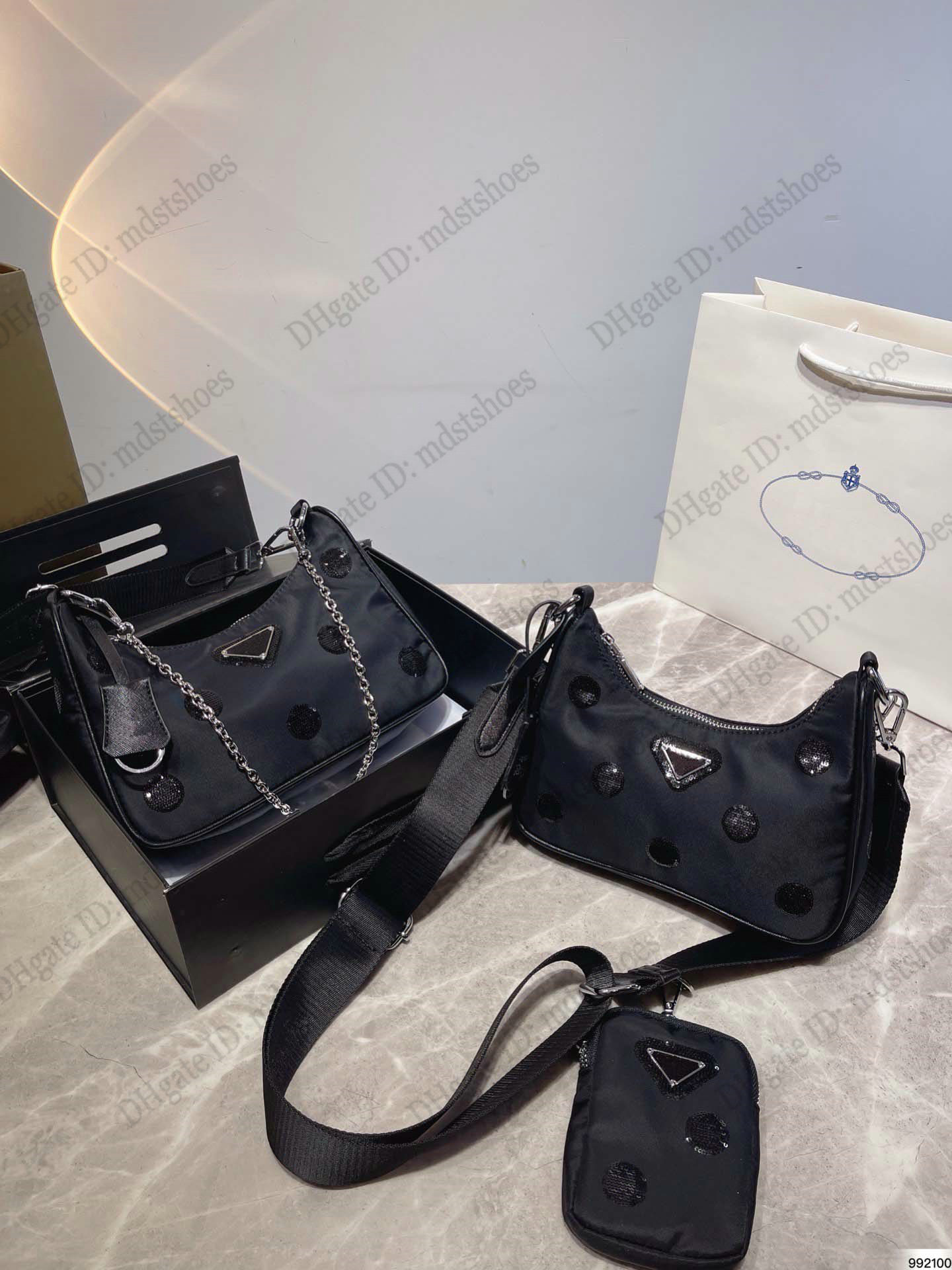 2005 Re-Nylon polka-dot Shoulder Bag Womens Designer Handbag Luxurys Nylon 2pcs Cross Body with a coordinated pouch chain handle bag
2005 Re-Nylon polka-dot Shoulder Bag Womens Designer Handbag Luxurys Nylon 2pcs Cross Body with a coordinated pouch chain handle bag