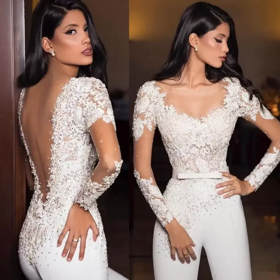 2022 White Wedding Dresses Jumpsuits Sexy Sheer Neck Lace Appliques Sequins Long Sleeve Bridal Gowns A Line Backless Wedding Dress VOG343
2022 White Wedding Dresses Jumpsuits Sexy Sheer Neck Lace Appliques Sequins Long Sleeve Bridal Gowns A Line Backless Wedding Dress VOG343