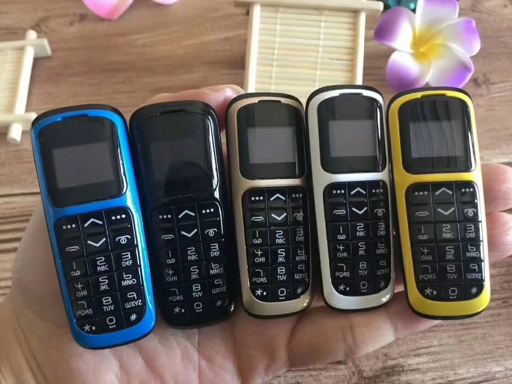 New Smallest Bar Cell phones Original V2 Intelligent Magic voice GSM Bluetooth Dial Mini Backup Pocket Portable Mobile Phone for Kids