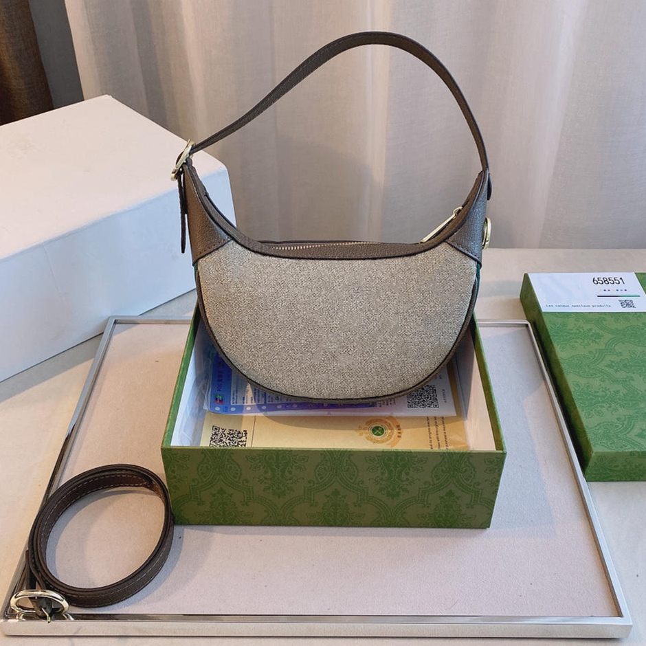 Fashion Brand Luxury Designer Ladies Shoulder Bags Underarm Bag Handbag Genuine Cowhide and PVC Fabric Women Purse Shoulder Half Moon Pack, Extra fee(not sale)
Fashion Brand Luxury Designer Ladies Shoulder Bags Underarm Bag Handbag Genuine Cowhide and PVC Fabric Women Purse Shoulder Half Moon Pack, Extra fee(not sale)