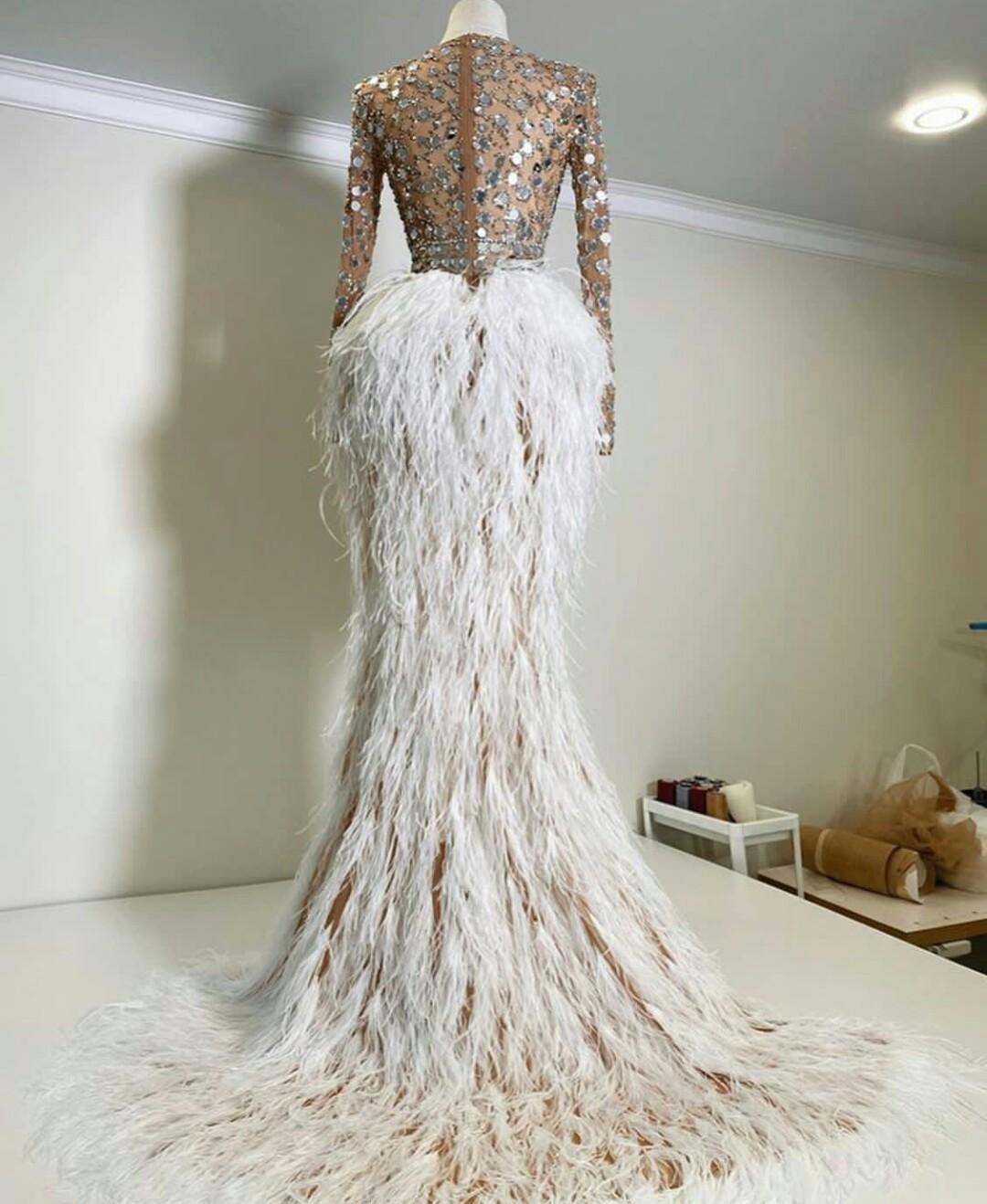 Sexy Illusion Top Evening Dresses with Sequins crystal african Hi Lo Feather Skirt Arabic Aso Ebi Prom Gowns with Long Sleeves