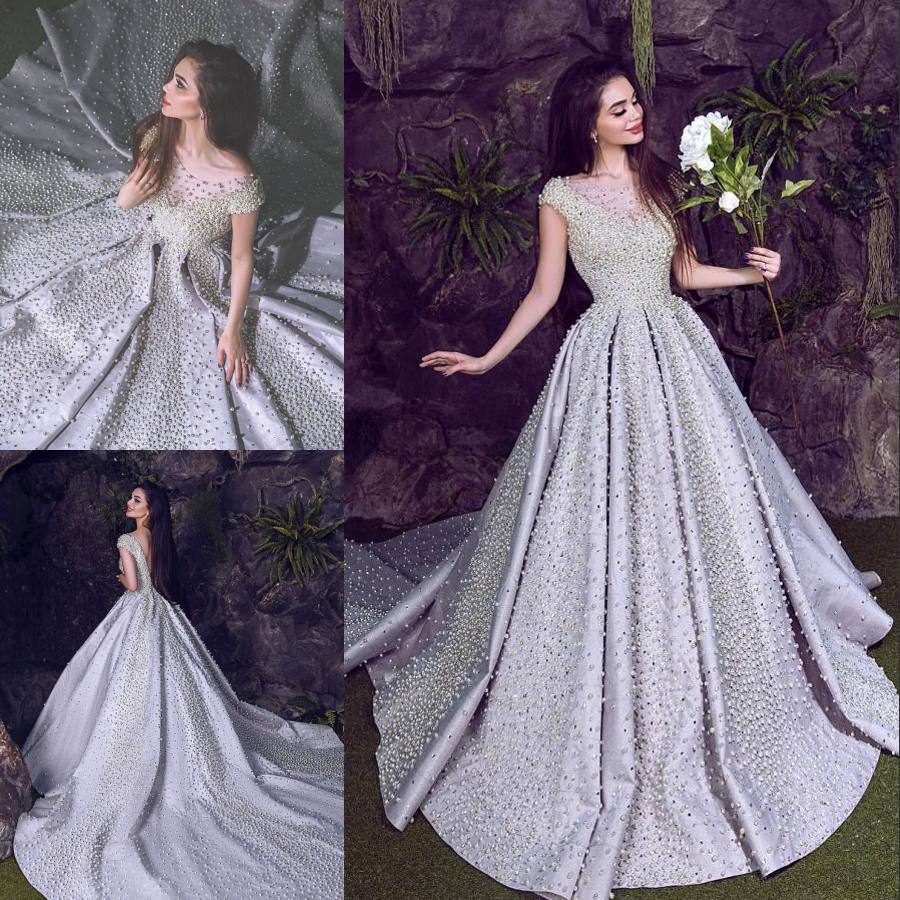 Gorgeous Pearls Backless Wedding Dresses A Line Sheer Bateau Neck Beaded Bridal Gowns Vestido De Novia Chapel Train Satin Wedding Dress, Same as image
Gorgeous Pearls Backless Wedding Dresses A Line Sheer Bateau Neck Beaded Bridal Gowns Vestido De Novia Chapel Train Satin Wedding Dress, Same as image