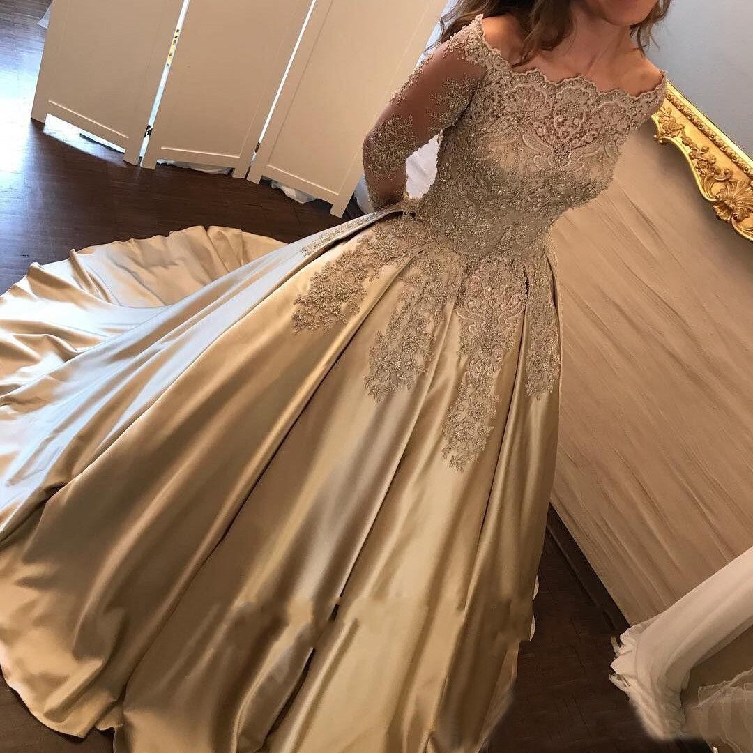 luxurious long sleeve ball gown with appliqu lace detailing and shimmering sequins for weddings