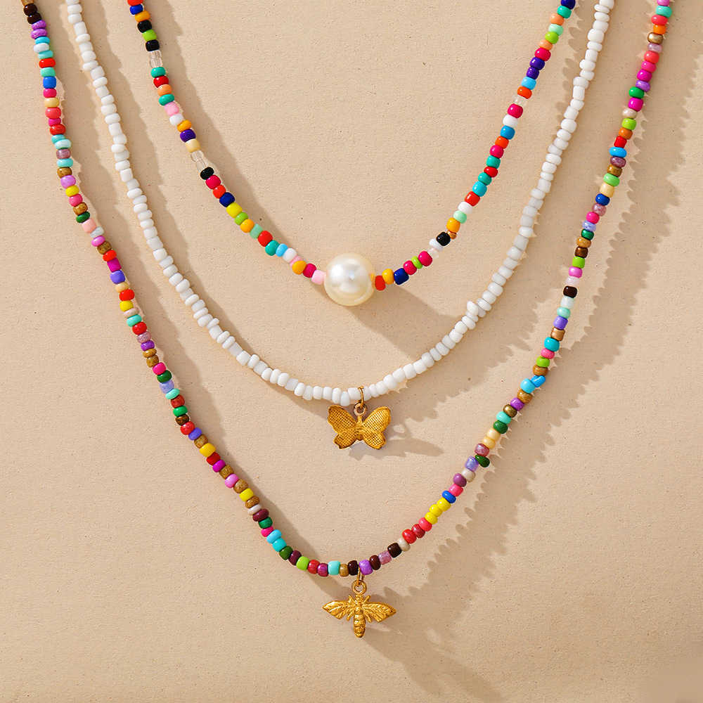 Womens pendant necklaces golded silver Creative Butterfly colorful rice bead clavicle chain Bohemian short Pearl Necklace 3-piece set
Womens pendant necklaces golded silver Creative Butterfly colorful rice bead clavicle chain Bohemian short Pearl Necklace 3-piece set