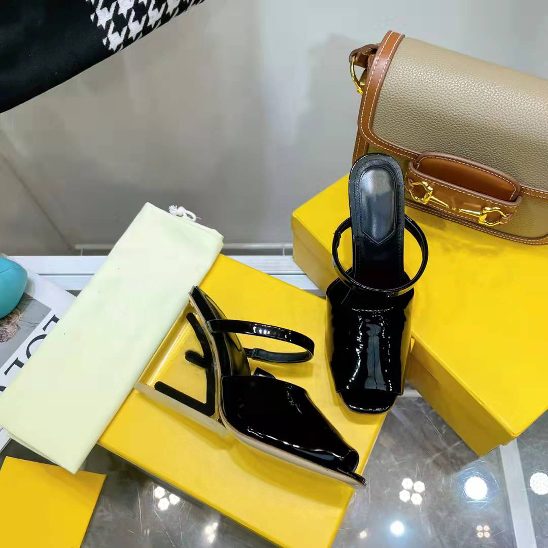 First Black leather high-heeled sandals with wide band and strap. Made of leather. Diagonal F-shaped sculpted heel in gold-coloured metal Size 35-42, Box
First Black leather high-heeled sandals with wide band and strap. Made of leather. Diagonal F-shaped sculpted heel in gold-coloured metal Size 35-42, Box