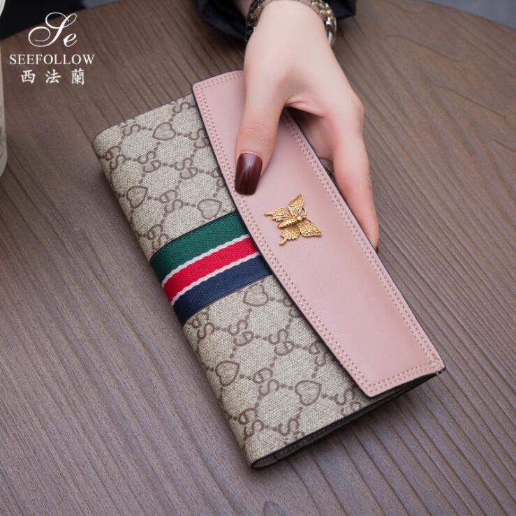 factory wholesale women brand shoulder bag simple multi-card printed womens purse sweet gold bow long wallet joker multifunctional leather e, Red;black
factory wholesale women brand shoulder bag simple multi-card printed womens purse sweet gold bow long wallet joker multifunctional leather e, Red;black