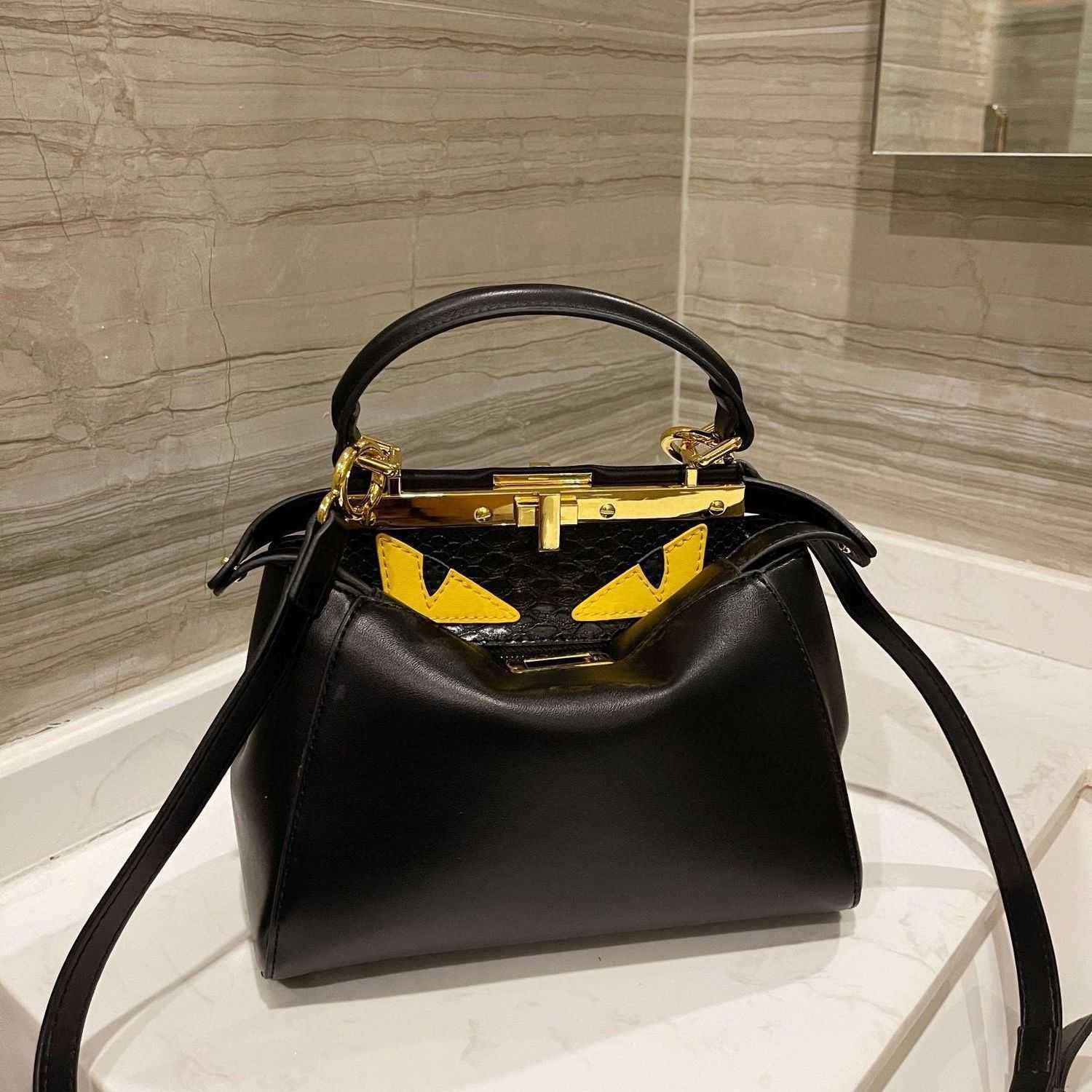 2021 spring and summer style small monster portable messenger one shoulder women's bag fashion versatile hide and seek bag Storage Bags
2021 spring and summer style small monster portable messenger one shoulder women's bag fashion versatile hide and seek bag Storage Bags