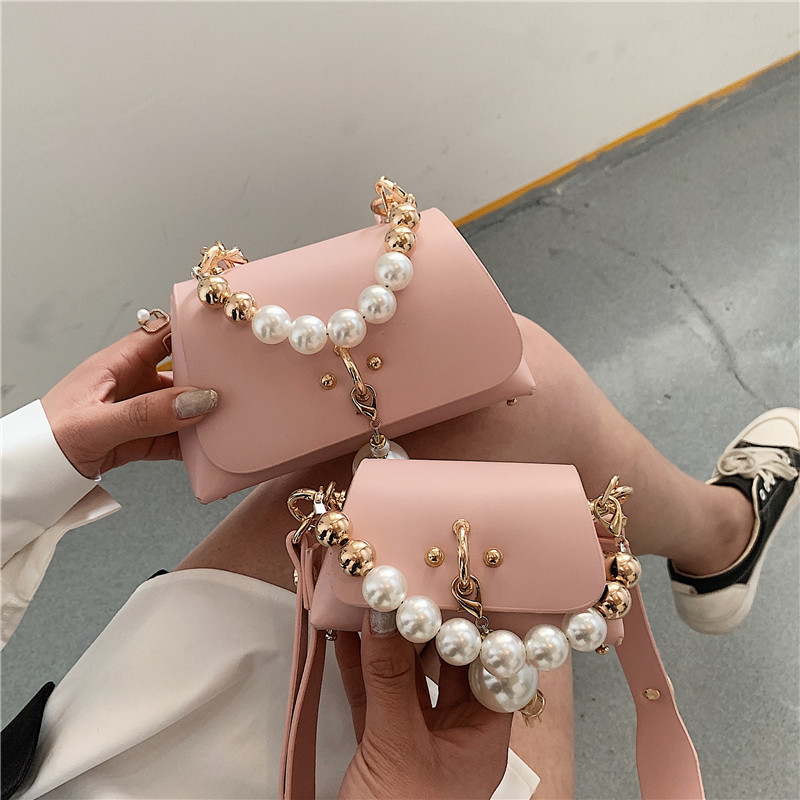 girls peral princess handbags parent-child style chain mini change purse fashion kids woman pearls accessories one shoulder bag F322, Pink
girls peral princess handbags parent-child style chain mini change purse fashion kids woman pearls accessories one shoulder bag F322, Pink