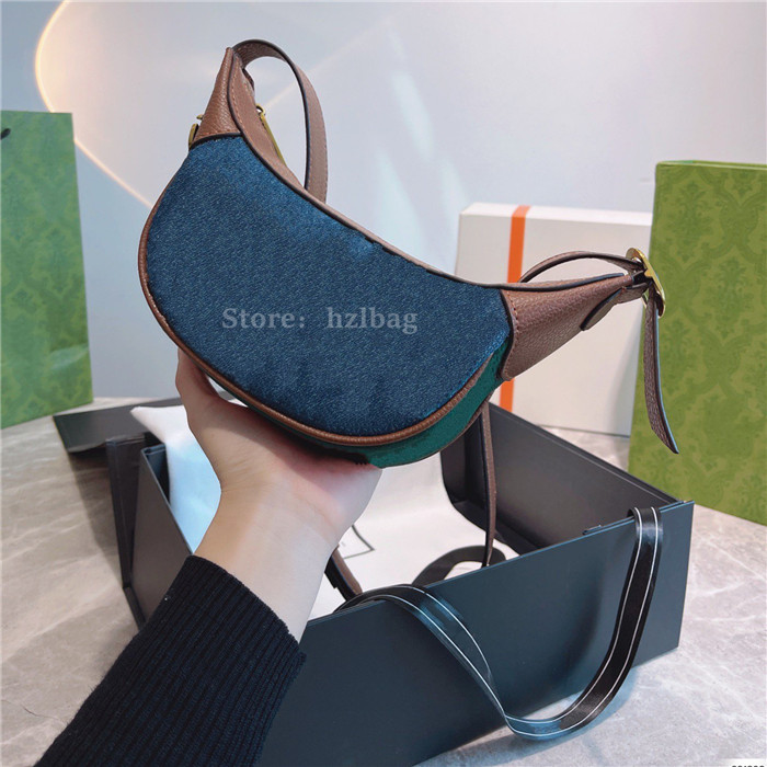Jackie 1961 Small Shoulder Bag Croissant Dark Blue Washed Jacquard Denim Cross Body Purse Sports and Leisure Handbag
Jackie 1961 Small Shoulder Bag Croissant Dark Blue Washed Jacquard Denim Cross Body Purse Sports and Leisure Handbag