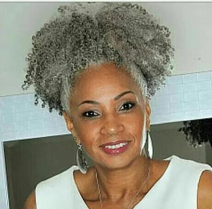 Beautiful woman with naturals grey kinky ponytail extension silver salt and pepper natural highlights dye free