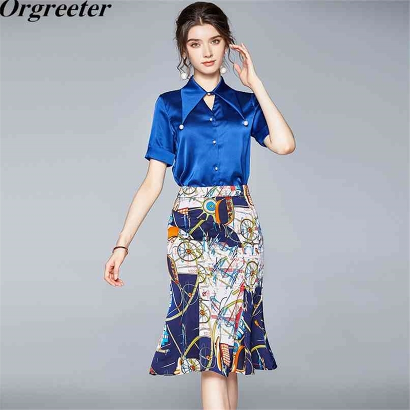 Temperament Ladies Work Wear Suit Summer Pearl Button Simple Blue Shirt and Retro Printed Mermaid Skirt Two piece Sets 210602
Temperament Ladies Work Wear Suit Summer Pearl Button Simple Blue Shirt and Retro Printed Mermaid Skirt Two piece Sets 210602