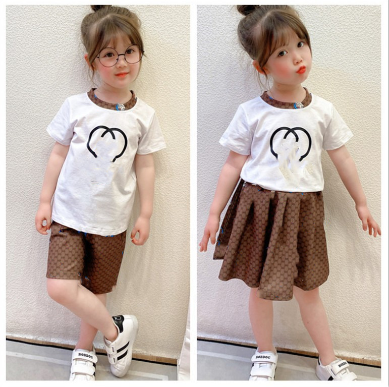 Children designer clothing set baby girls summer cartoon letter printed short sleeve T-shirt + print shorts / skirt 2pcs suits brother siste, White
Children designer clothing set baby girls summer cartoon letter printed short sleeve T-shirt + print shorts / skirt 2pcs suits brother siste, White