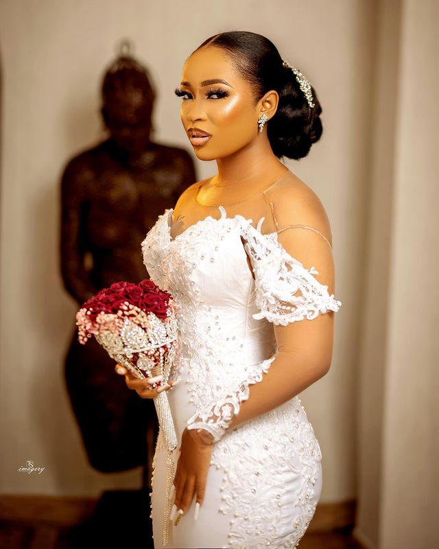 African Sexy Arabic Mermaid Wedding Dresses Jewel Neck Illusion Crystal Beaded Long Sleeves Button Back Satin Court Train Plus Size Bridal Gowns