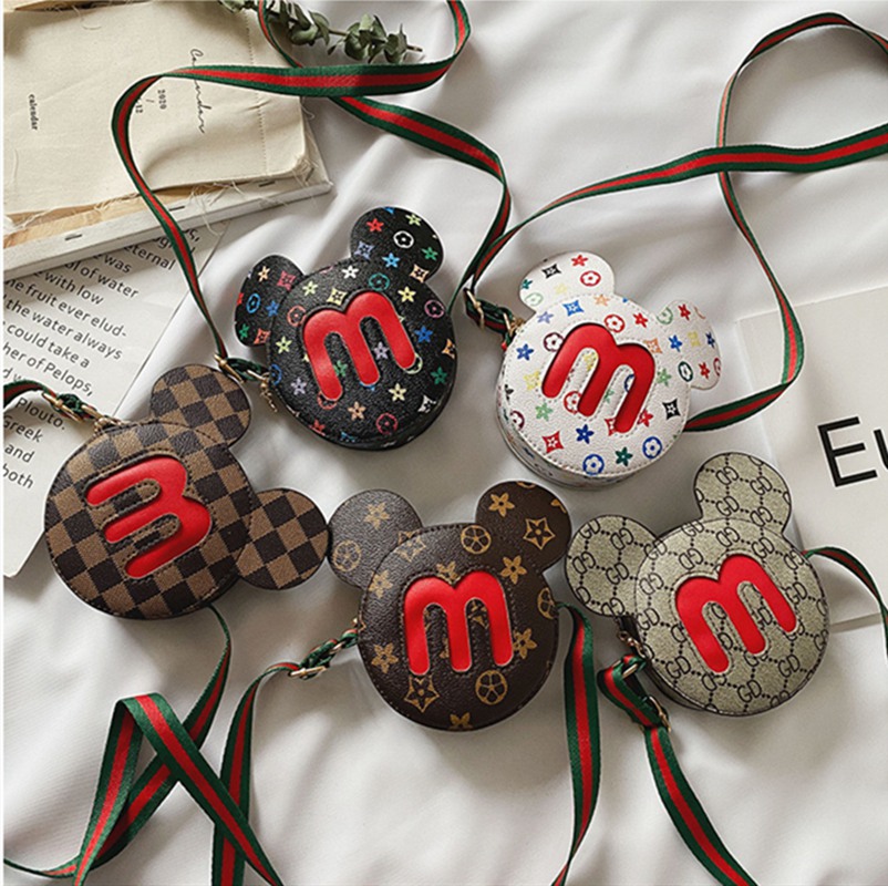 Kids letter flower design cartoon bags Baby Girls Mini Princess purse fashion one shoulder messenger bag girl coin wallet 
Kids letter flower design cartoon bags Baby Girls Mini Princess purse fashion one shoulder messenger bag girl coin wallet
