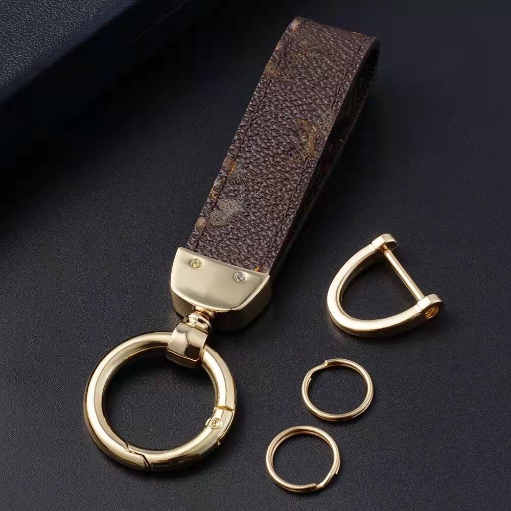 Designer high-end car keychain lattice ladies men's handmade leather key cover key ring chain pendant accessories all-match
Designer high-end car keychain lattice ladies men's handmade leather key cover key ring chain pendant accessories all-match