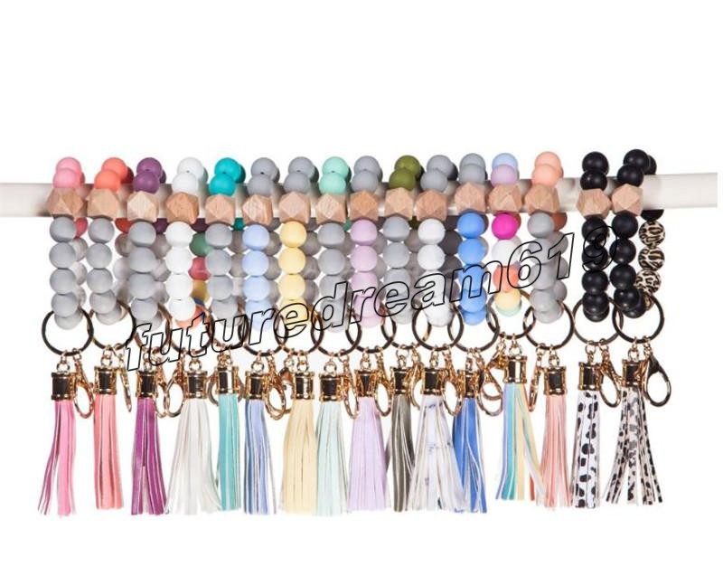 14 style Tassels Wood Bead Keychain Silicone Beads Bracelet Party Favor Leather Key Ring Food Grade Wrist Keychains
14 style Tassels Wood Bead Keychain Silicone Beads Bracelet Party Favor Leather Key Ring Food Grade Wrist Keychains