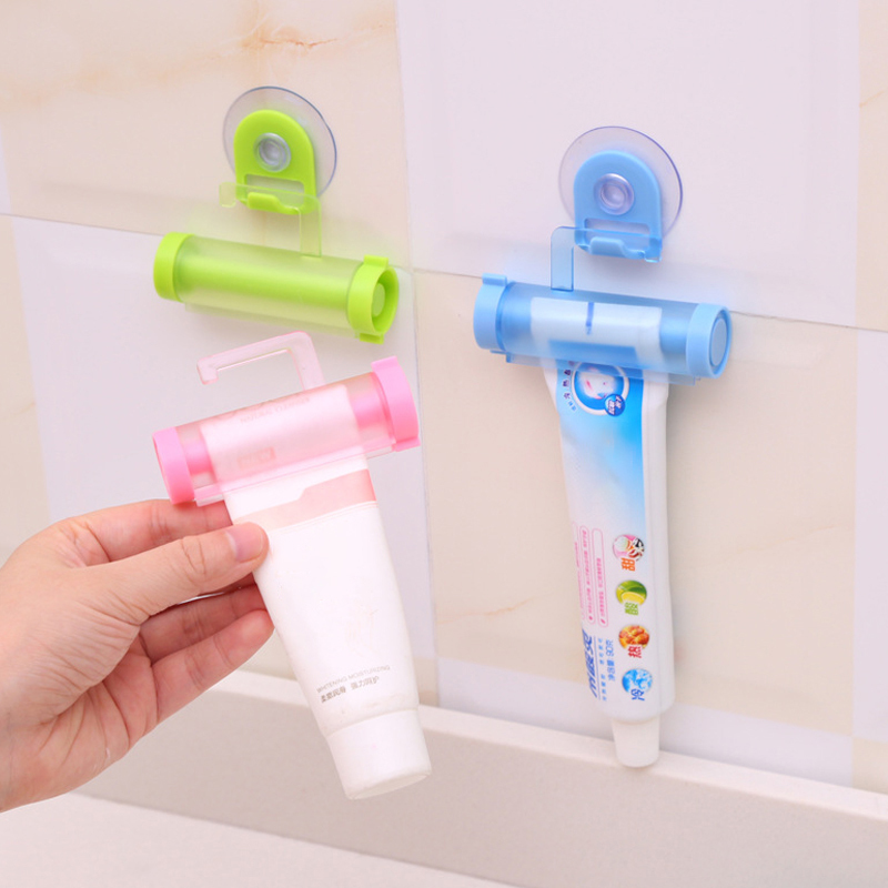 1Pcs With Sucker Hook Portable Multi Purpose Plastic Reuse Rolling Squeezer Toothpaste Dispenser Manual Bathroom Accessories