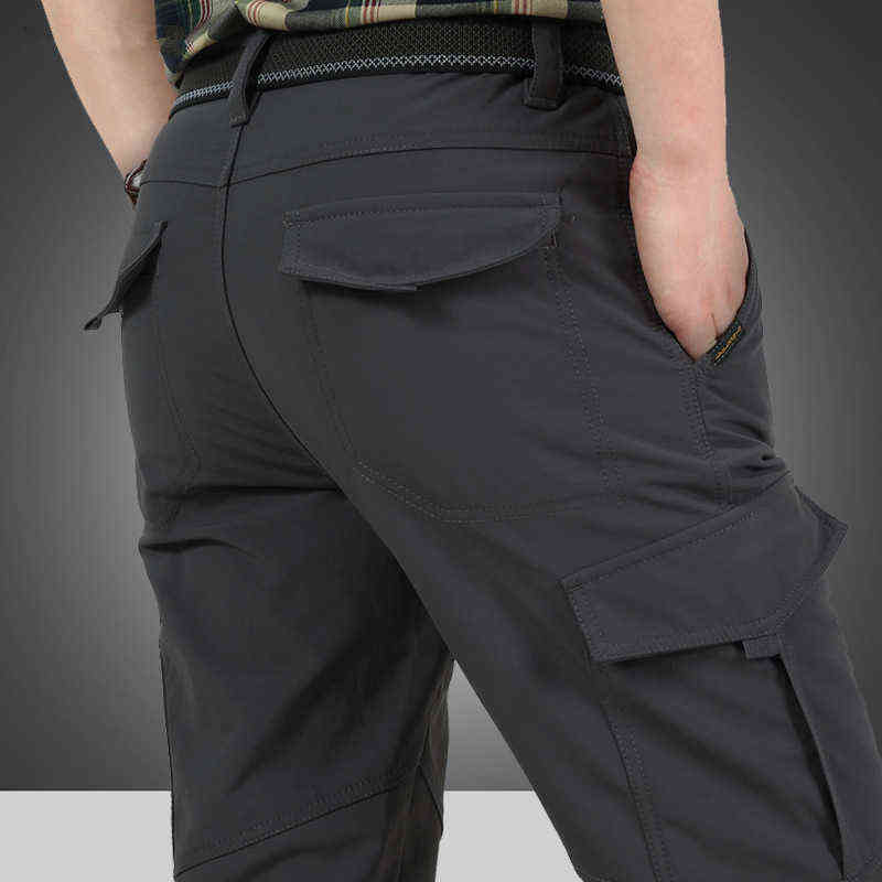 Men Winter Thick Warm Cargo Pants Casual Fleece Pockets Long Trousers Fashion Loose Baggy Jogeer Worker Male Pants 4XL 211112